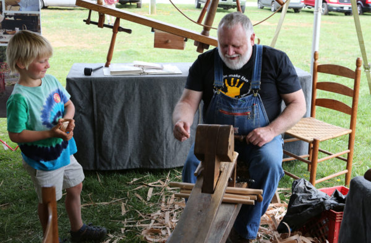 Lyle Wheeller demonstrates woodworking on a shaving horse
